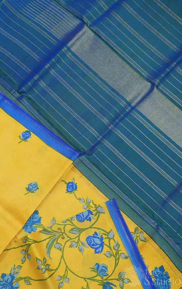 Yellow digital printed kanchipuram silk saree with peacock blue pallu
