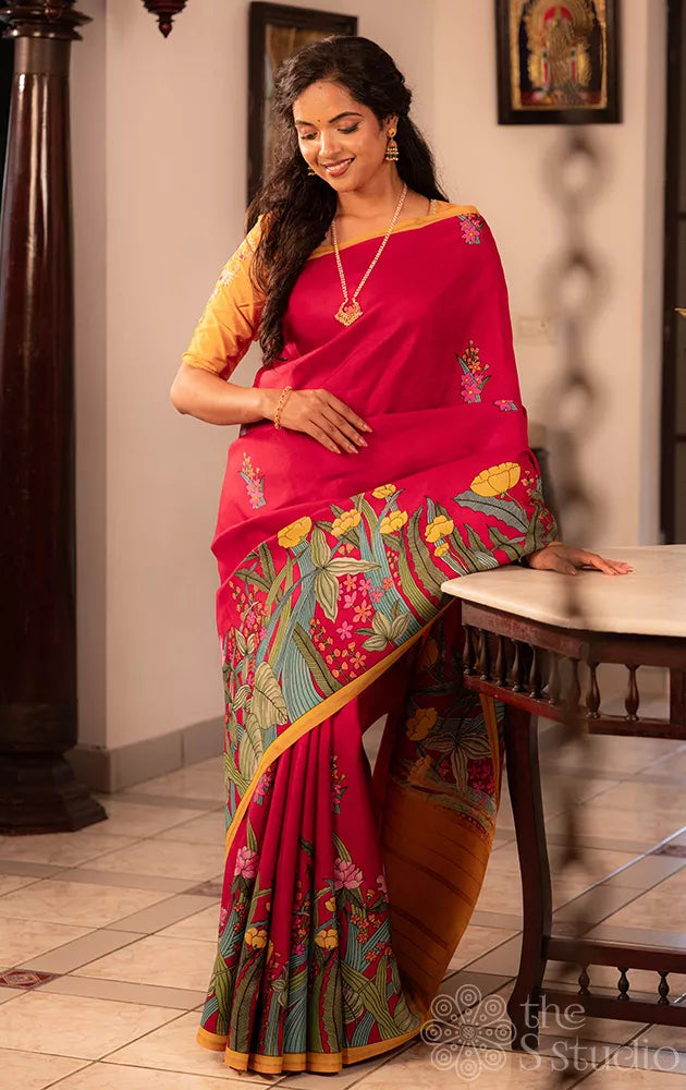 Maroon kanchi silk saree with floral prints along border