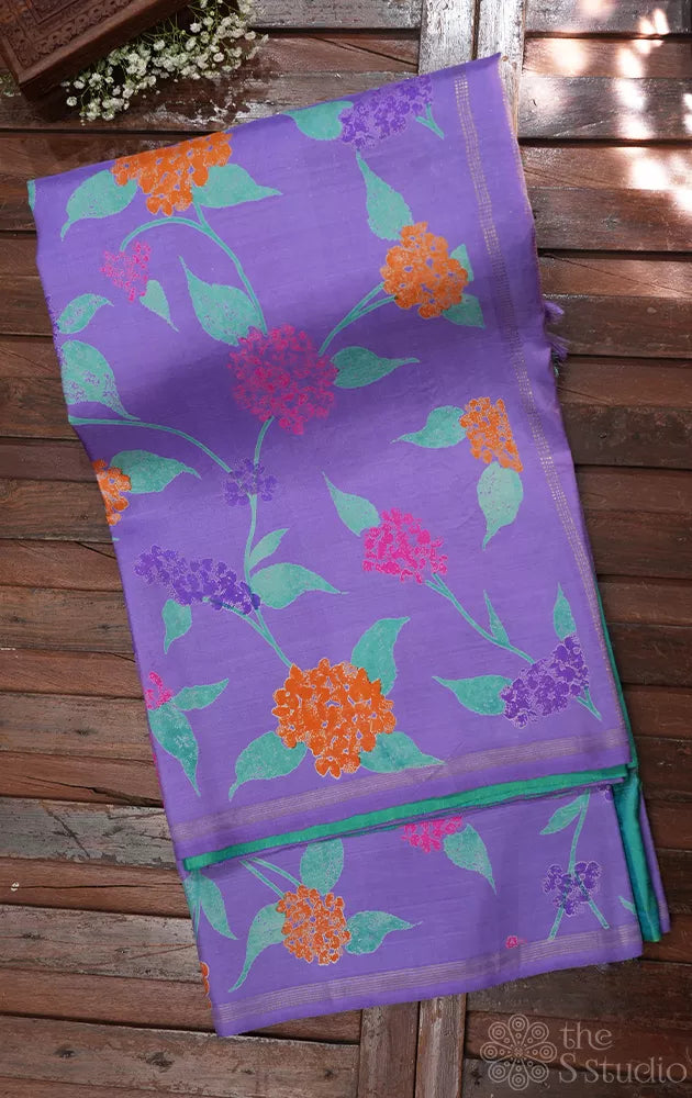 Lavendar and sea green reversible half and half kanchipuram silk saree with floral prints