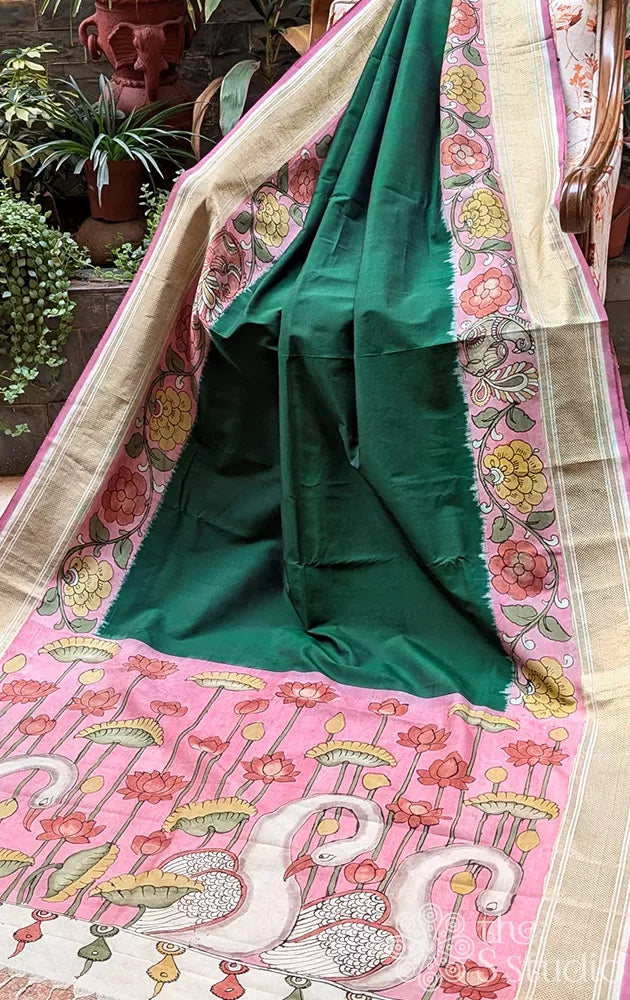 Green pochampally ikat silk saree with pink pen kalamkari border