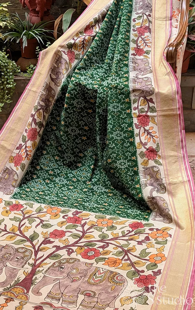 Green ikkat silk saree with hand painted kalamkari border and pallu