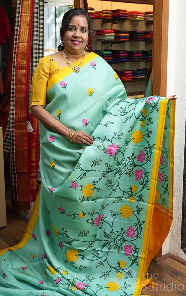 Aqua blue printed kanchi pattu saree with yellow pallu