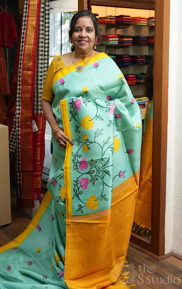 Aqua blue printed kanchi pattu saree with yellow pallu