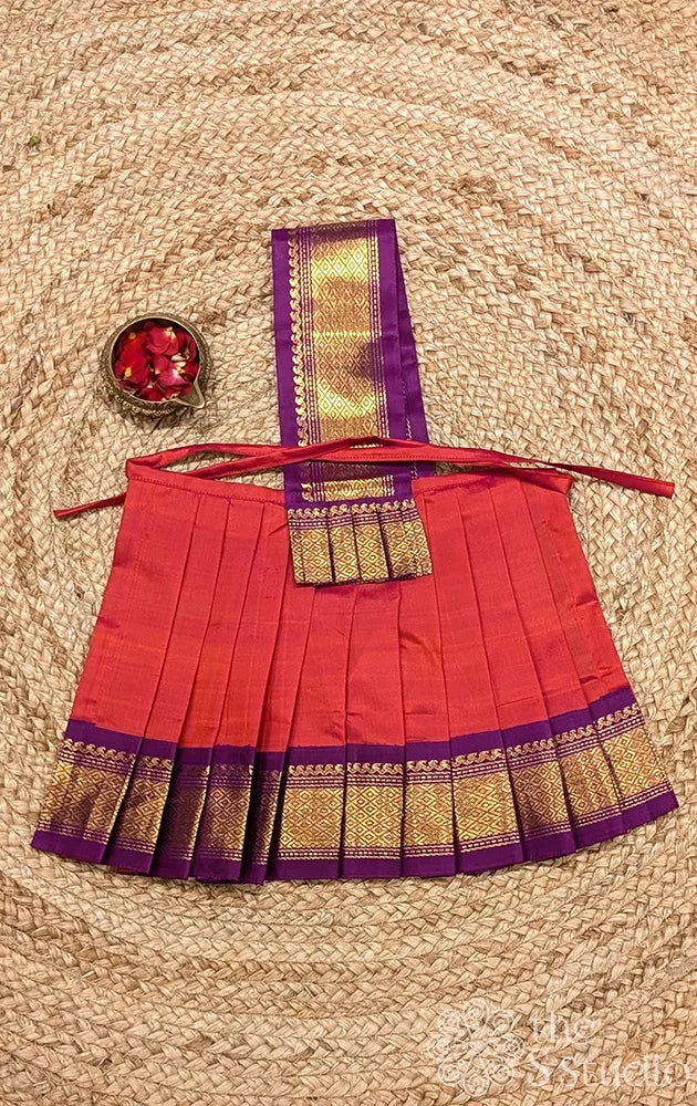 Peachish orange 10 Inch goddess vasthram with purple getti zari border