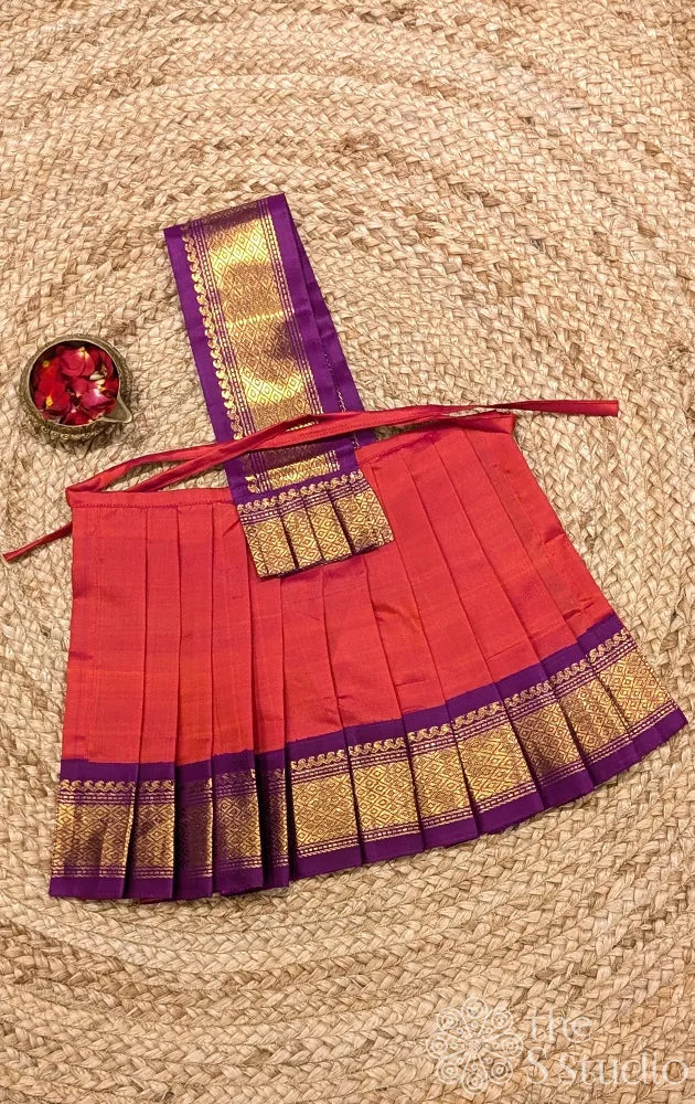 Peachish orange 10 Inch goddess vasthram with purple getti zari border