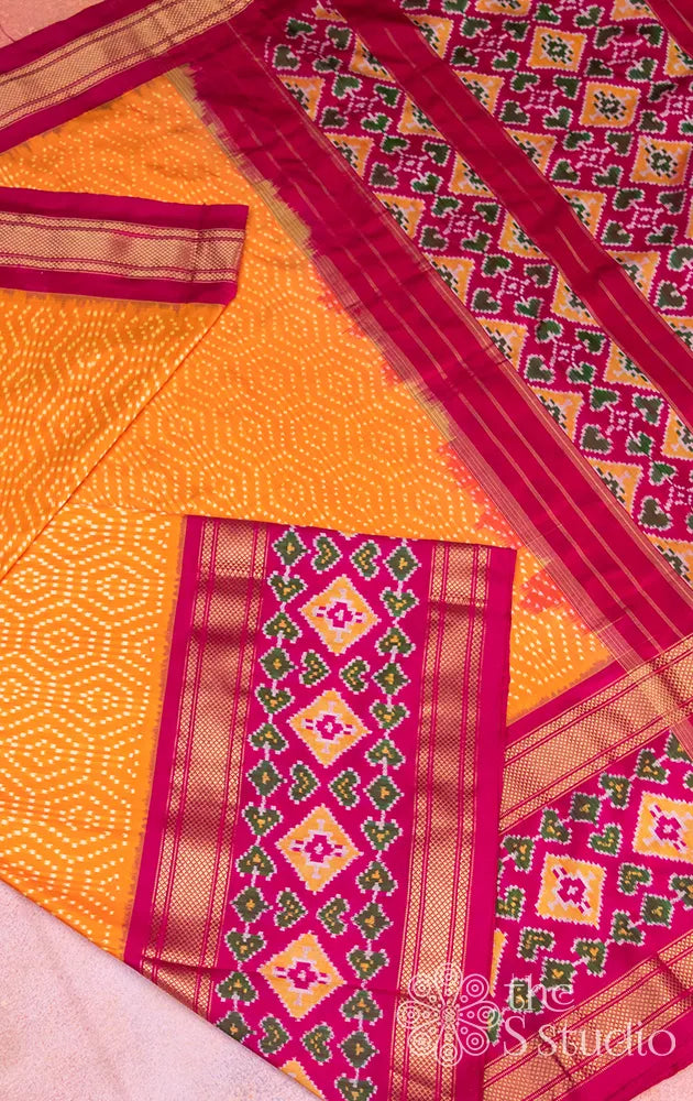 Mango orange ikkat silk saree with rani pink border