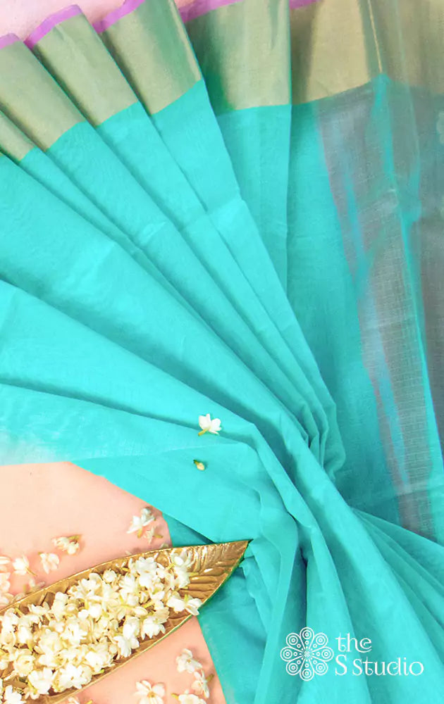 Sea green silk cotton saree with zari woven border