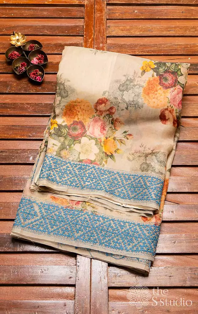 Beige printed organza saree with Kutch embroidered border