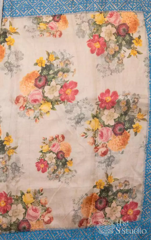 Beige printed organza saree with Kutch embroidered border