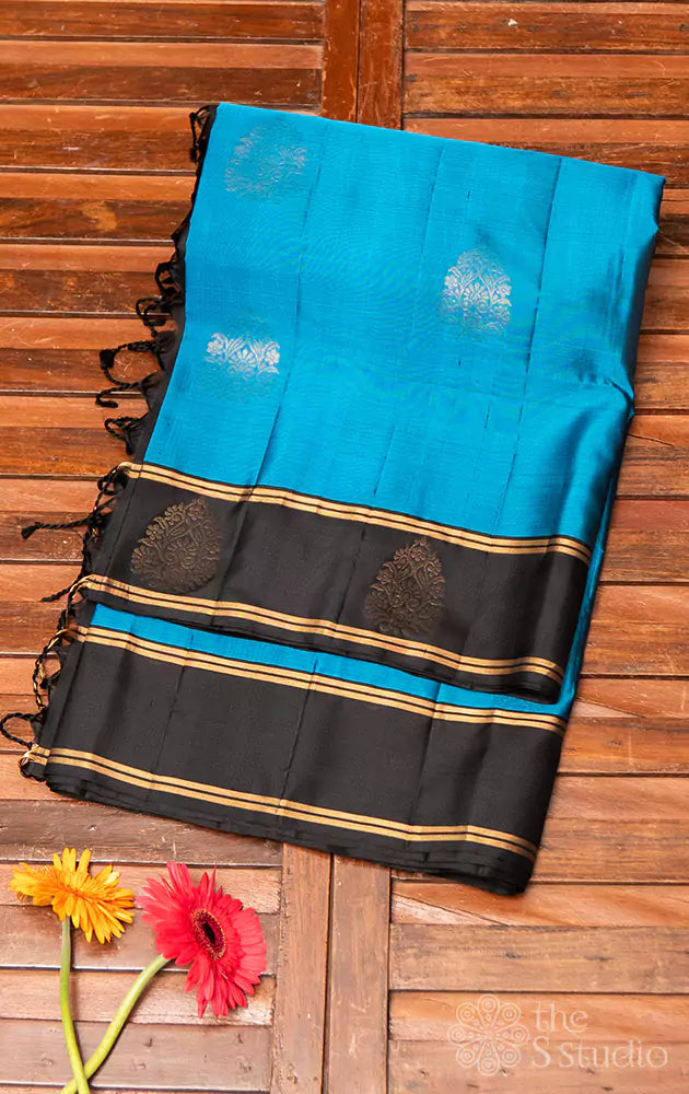 Blue soft silk saree with small black border