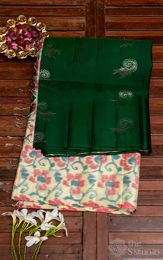 Green butta woven soft silk saree with long ikkat border and pallu