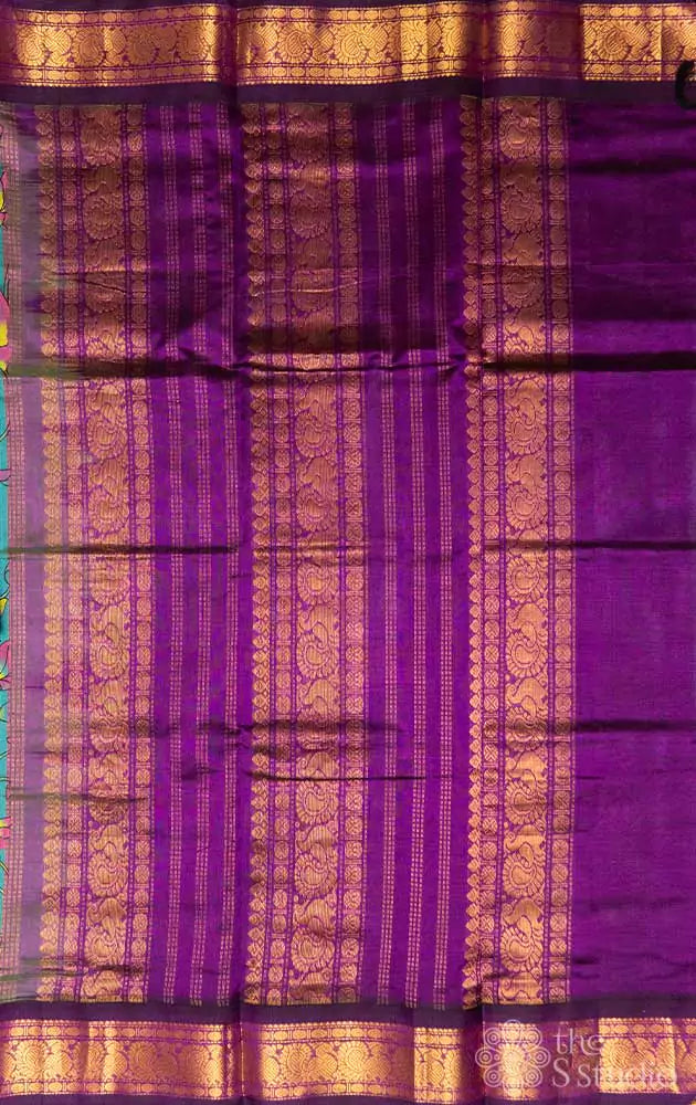 Sea green silk cotton saree with block print and purple border