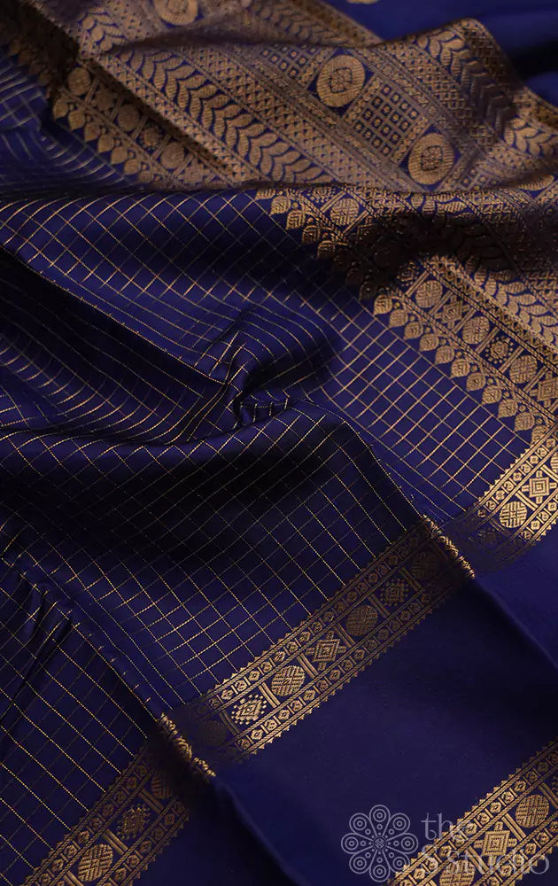 Indigo blue kanchi silk saree with checks and  parrot pallu