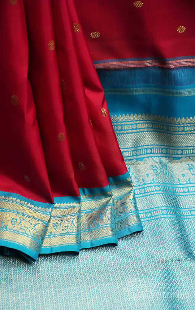 Red kanjivaram saree with korvai blue border