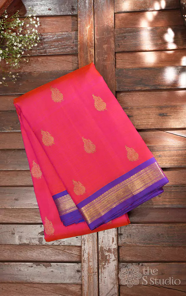 Peachish pink kanchipuram silk saree with purple small border