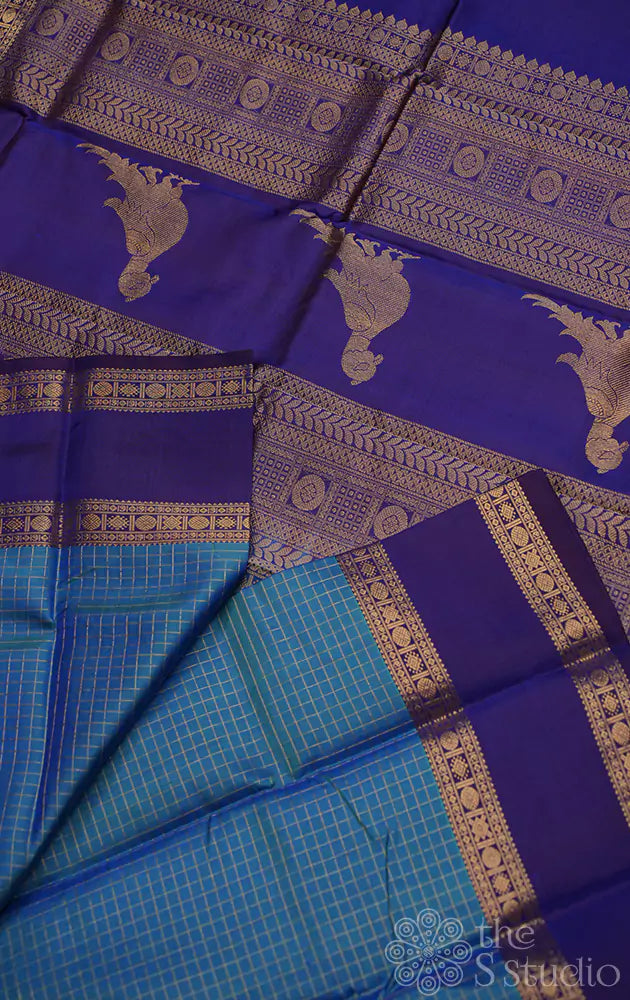 Anadha blue kanchi silk saree with checks and  parrot pallu