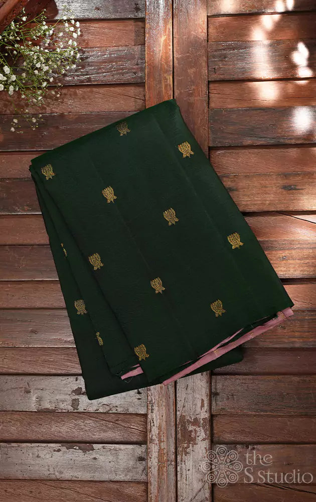 Bottle green kanchi silk saree with small lotus buttas