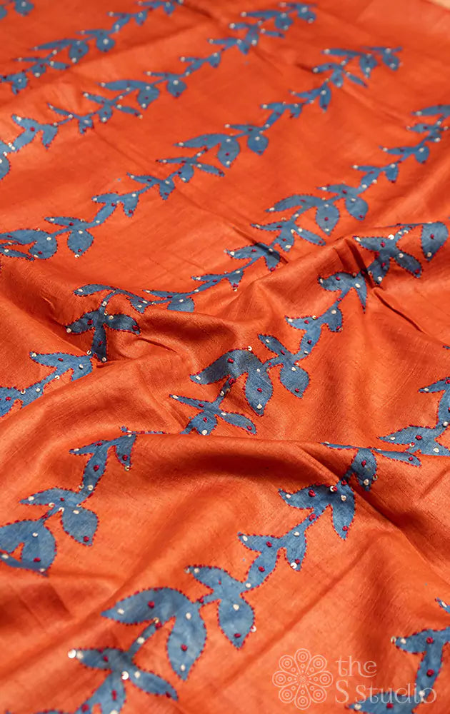 Orange tussar floral printed saree with embroidery
