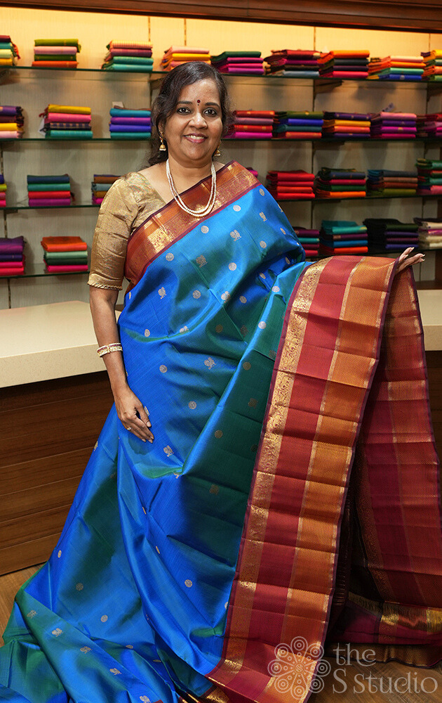 Peacock blue kanchipuram silk saree with maroon korvai border