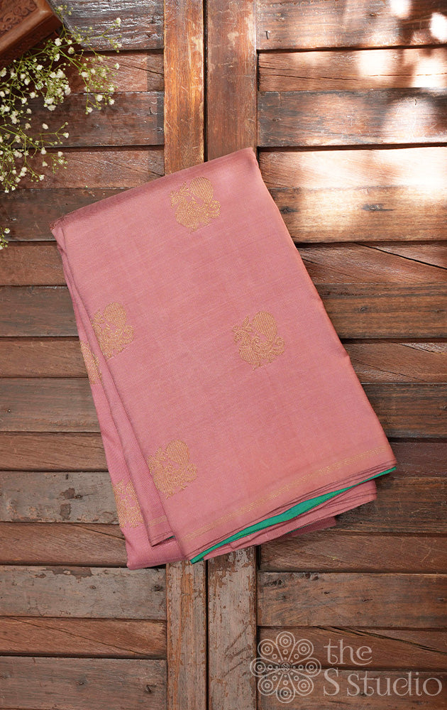 Onion pink kanchi silk saree with annam buttas all over and a contrast sea green pallu