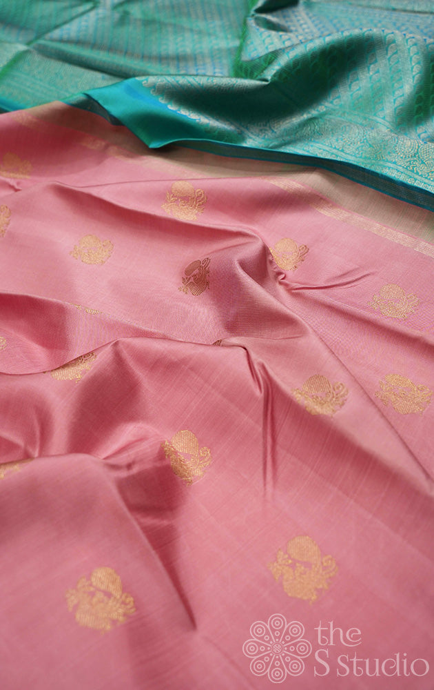 Onion pink kanchi silk saree with annam buttas all over and a contrast sea green pallu