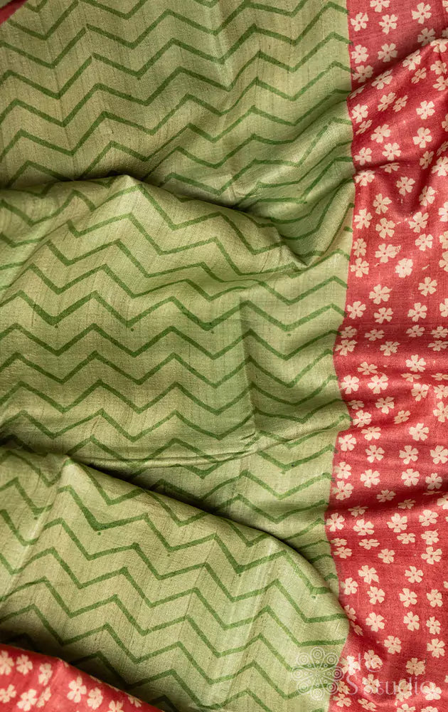 Pastel green tussar silk saree with reddish floral printed border