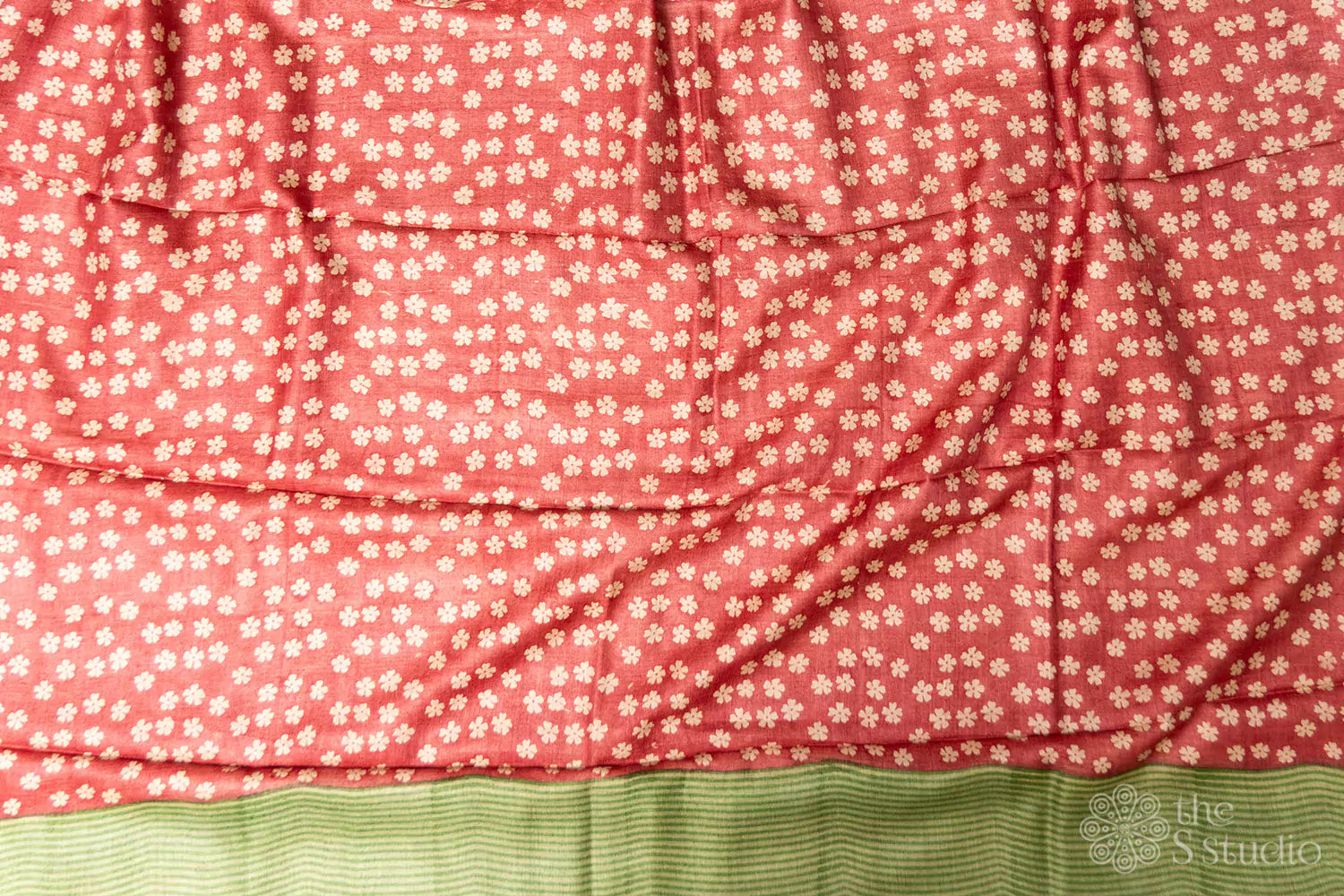Pastel green tussar silk saree with reddish floral printed border