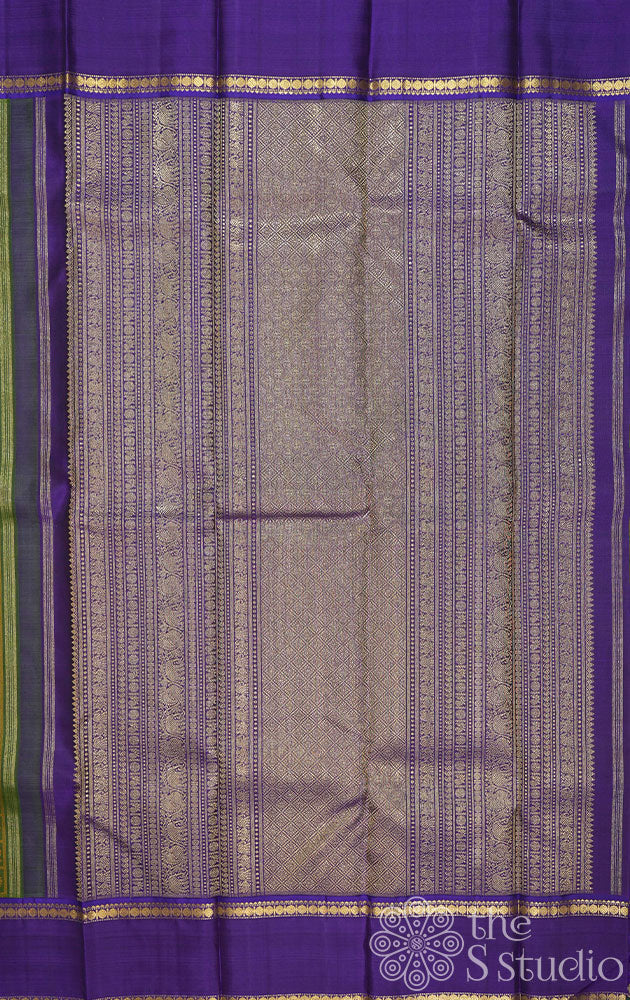 Chutney green kanchi silk saree with violet rettai pet border