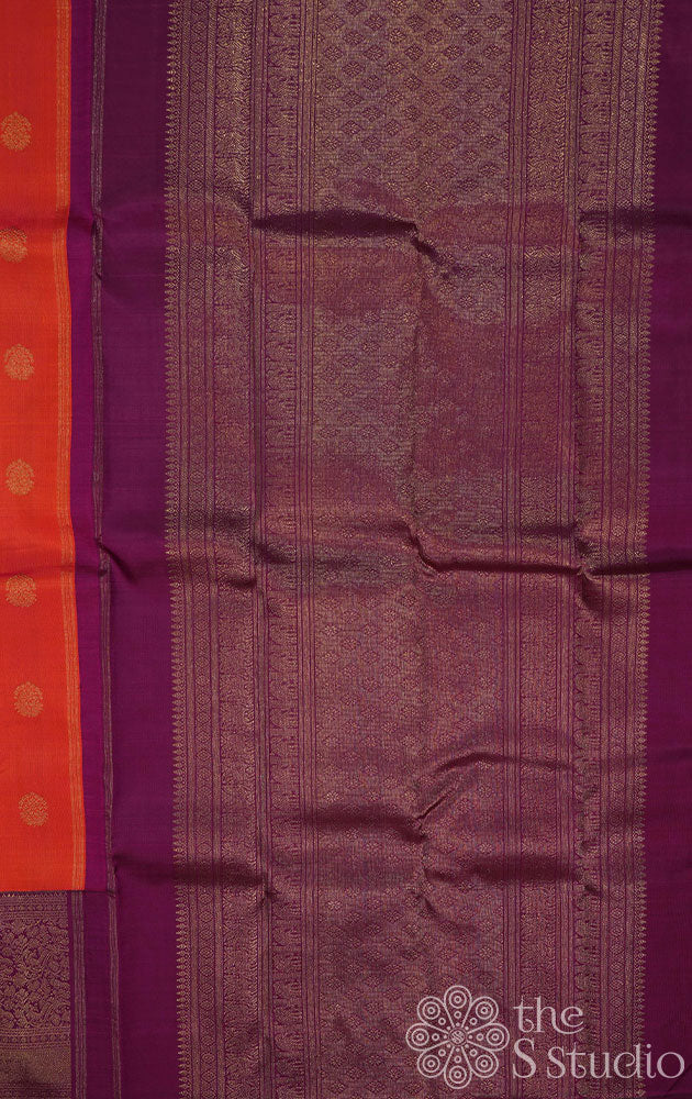 Burnt orange kanjivaram silk saree with a purple korvai border