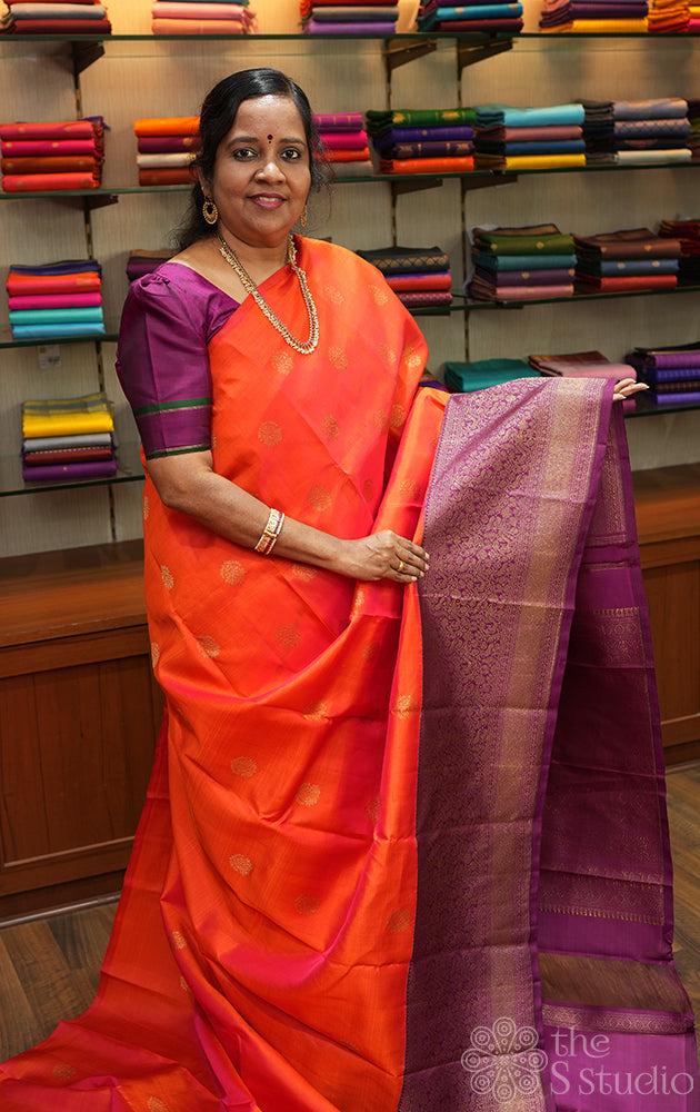 Burnt orange kanjivaram silk saree with a purple korvai border