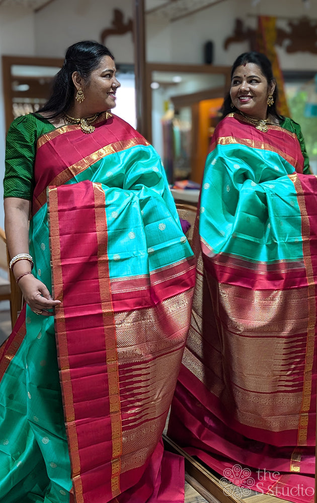 Sea green kanjivaram saree with red border