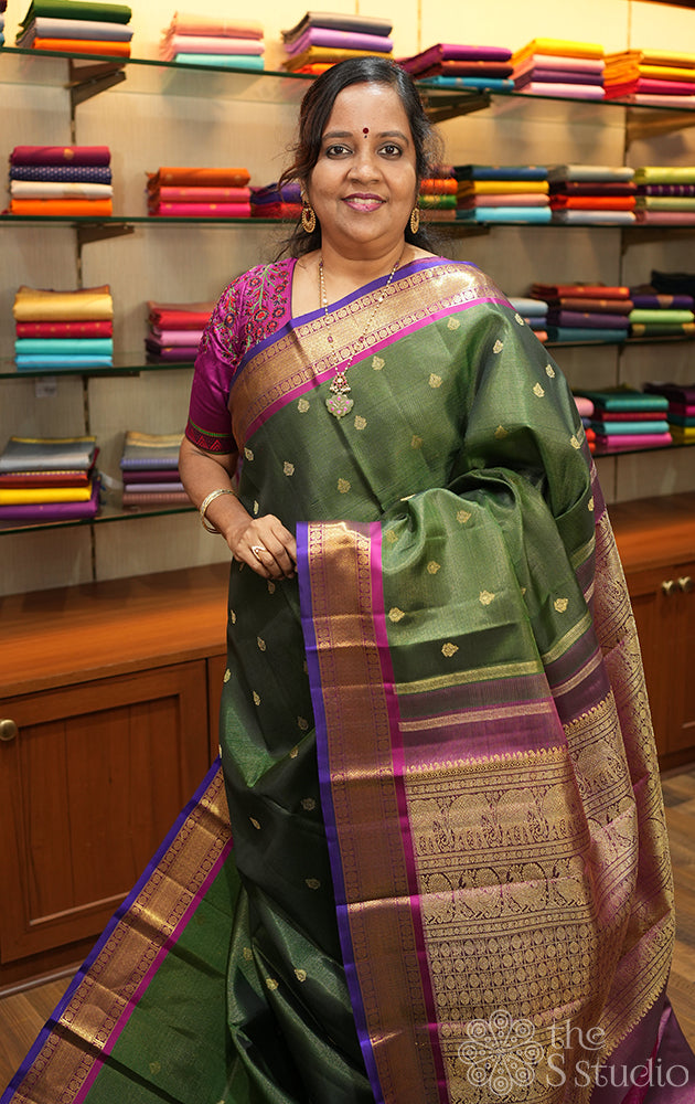 Emerald green vaira oosi kanchi silk saree with rani pink border