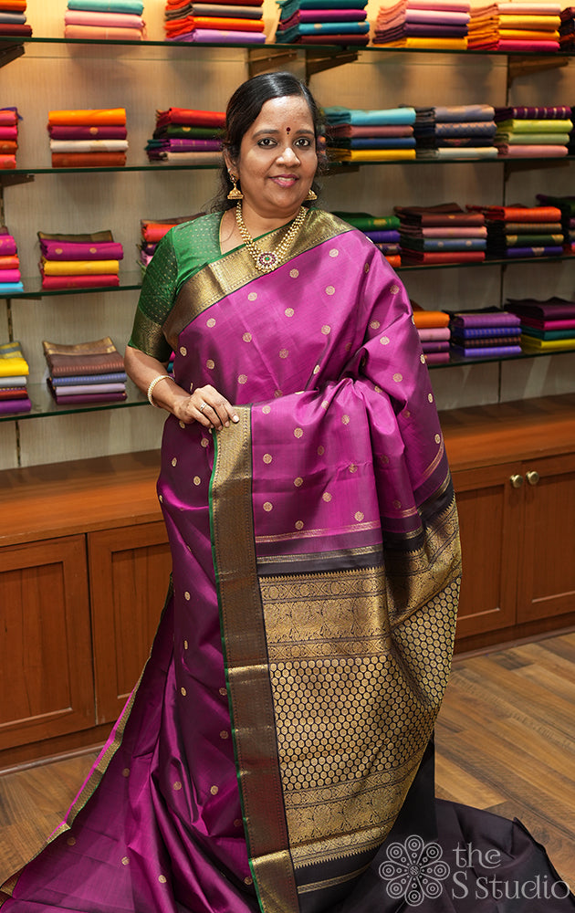 Deep magenta kanjivaram saree with small brown border