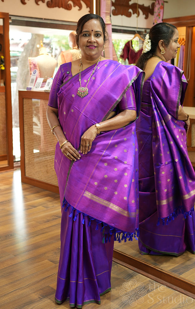 Purple kanjivaram silk saree with small buttas and rettai pet border
