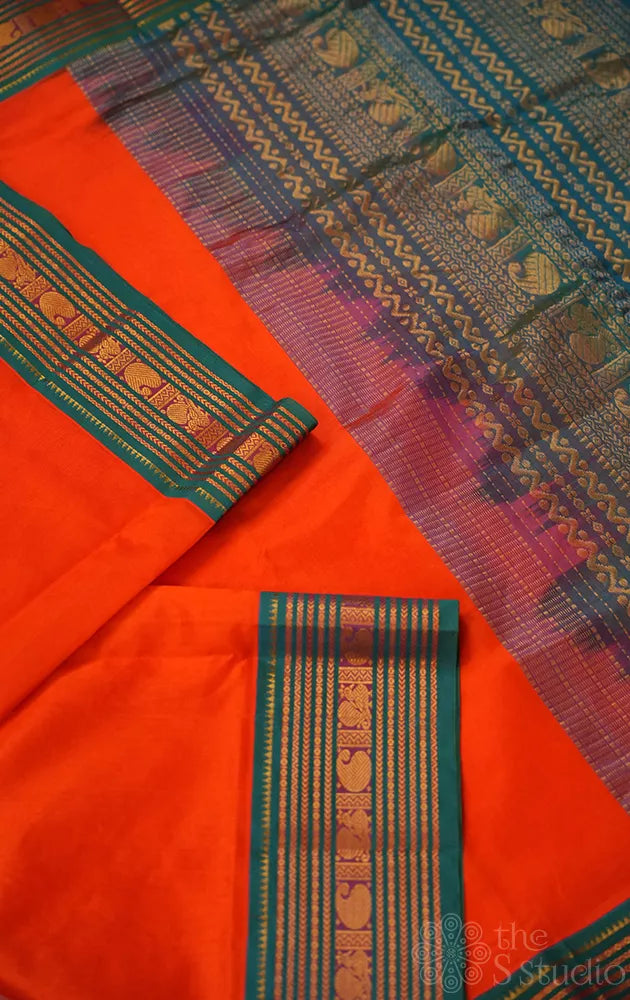 Bright orange silk cotton saree with sea blue korvai border