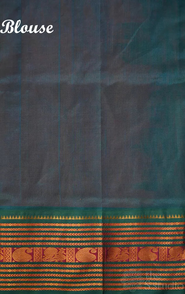 Bright orange silk cotton saree with sea blue korvai border