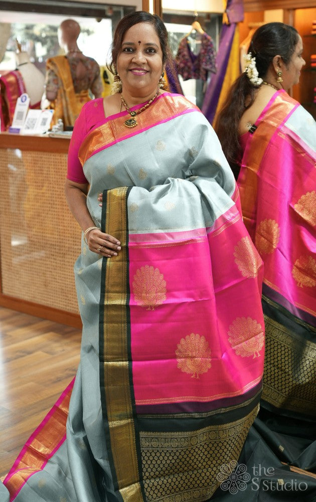 Grey kanjivaram silk saree with ganga jamuna korvai borders