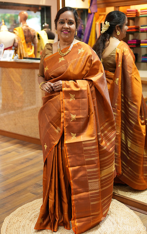 Honey rust kanjivaram silk saree with vertical zari lines