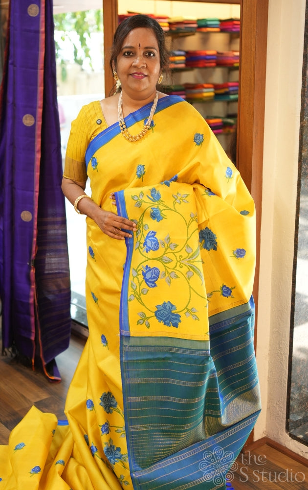 Yellow digital printed kanchipuram silk saree with peacock blue pallu