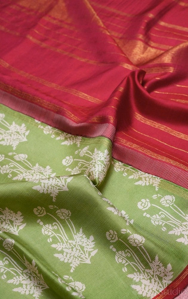 Elachi green kanchipuram silk saree with prints and a maroon pallu