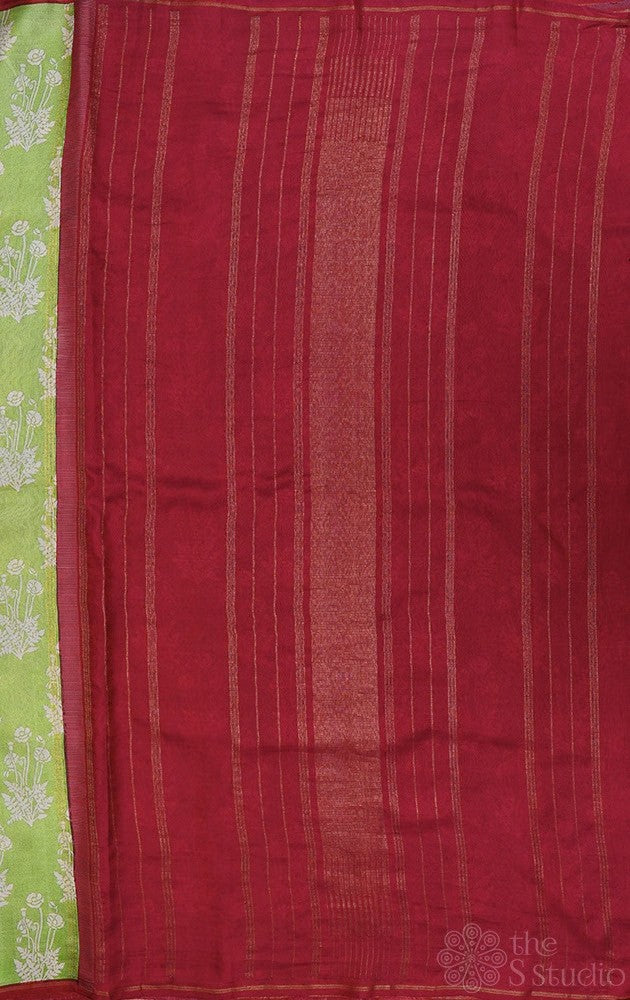 Elachi green kanchipuram silk saree with prints and a maroon pallu