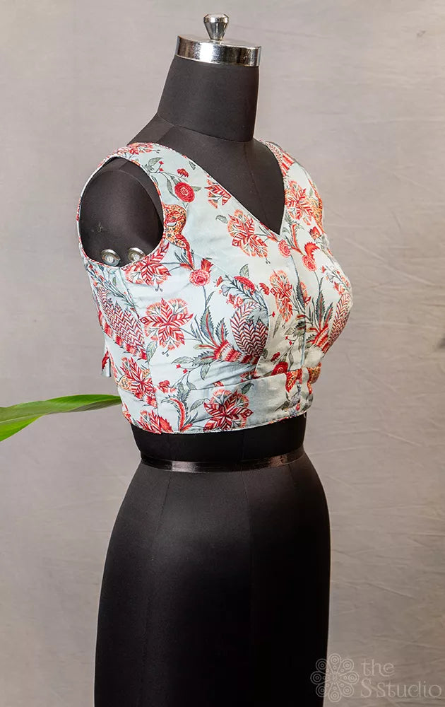 Light  blue floral printed sleeveless semi silk  readymade blouse
