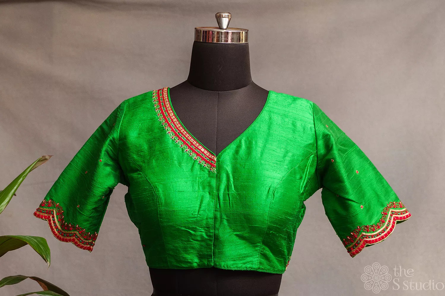 Green raw silk readymade blouse with aari work embroidery