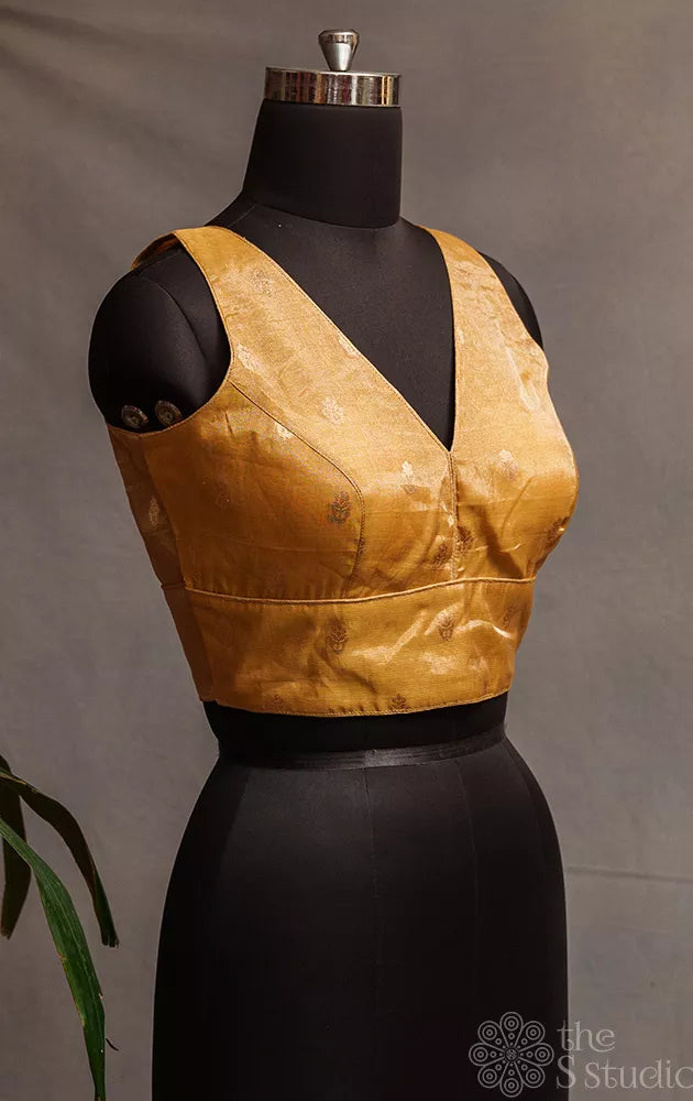 Golden tissue sleeveless readymade blouse with zari buttas