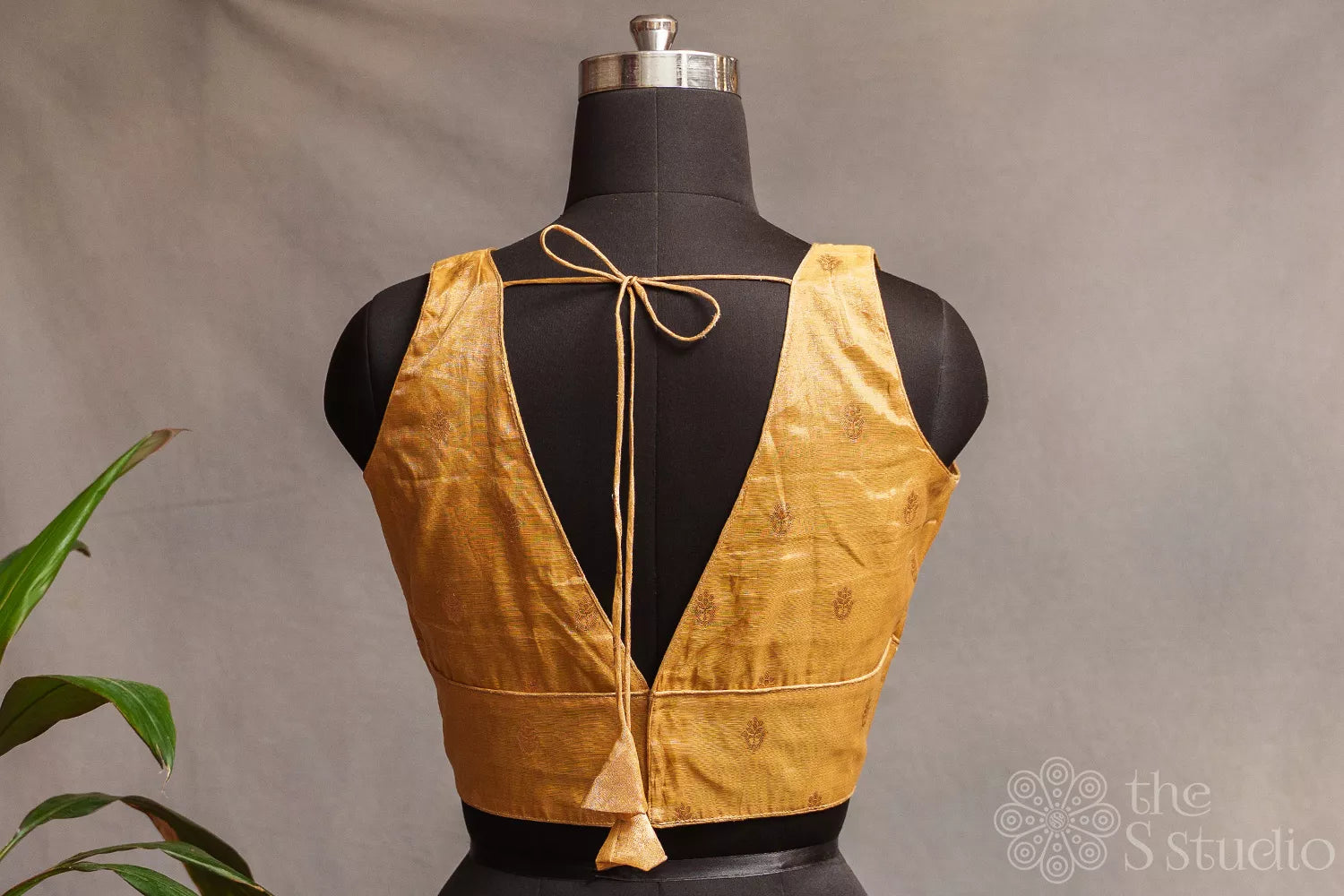 Golden tissue sleeveless readymade blouse with zari buttas