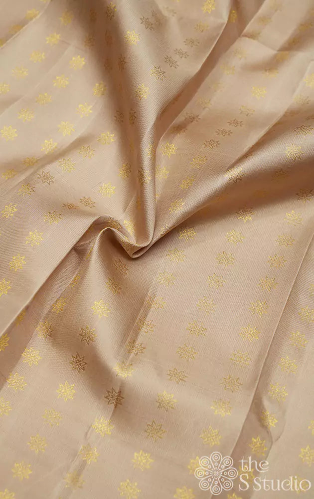 Beige kanchi silk blouse material with small zari kamalam buttas