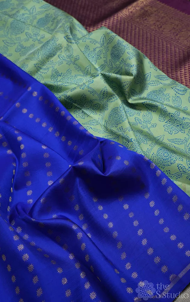 Elachi green and royal blue partly pallu kanchi silk saree with prints