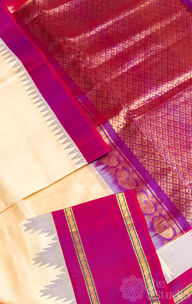 Offwhite silk cotton saree with purple rettaipet border