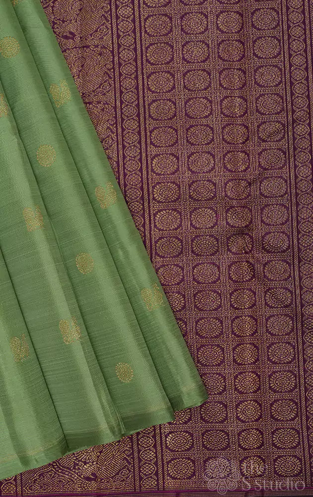 Elachi green kanjivaram saree with deep magenta pallu