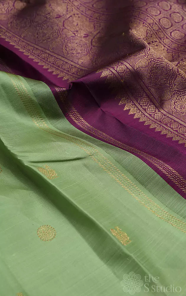 Elachi green kanjivaram saree with deep magenta pallu